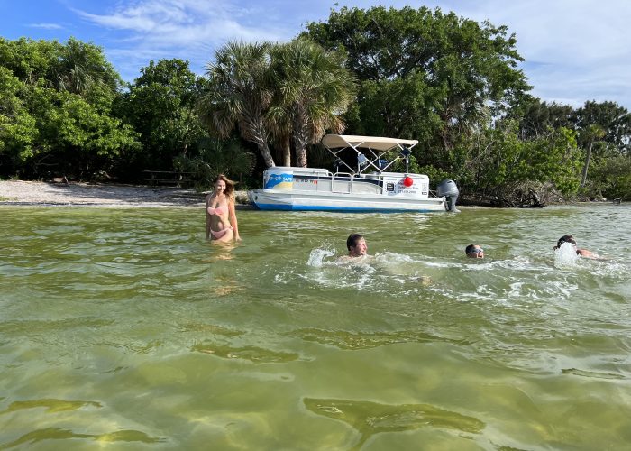 11Kids on a swimming in a dolphin & manatee lagoon tour
